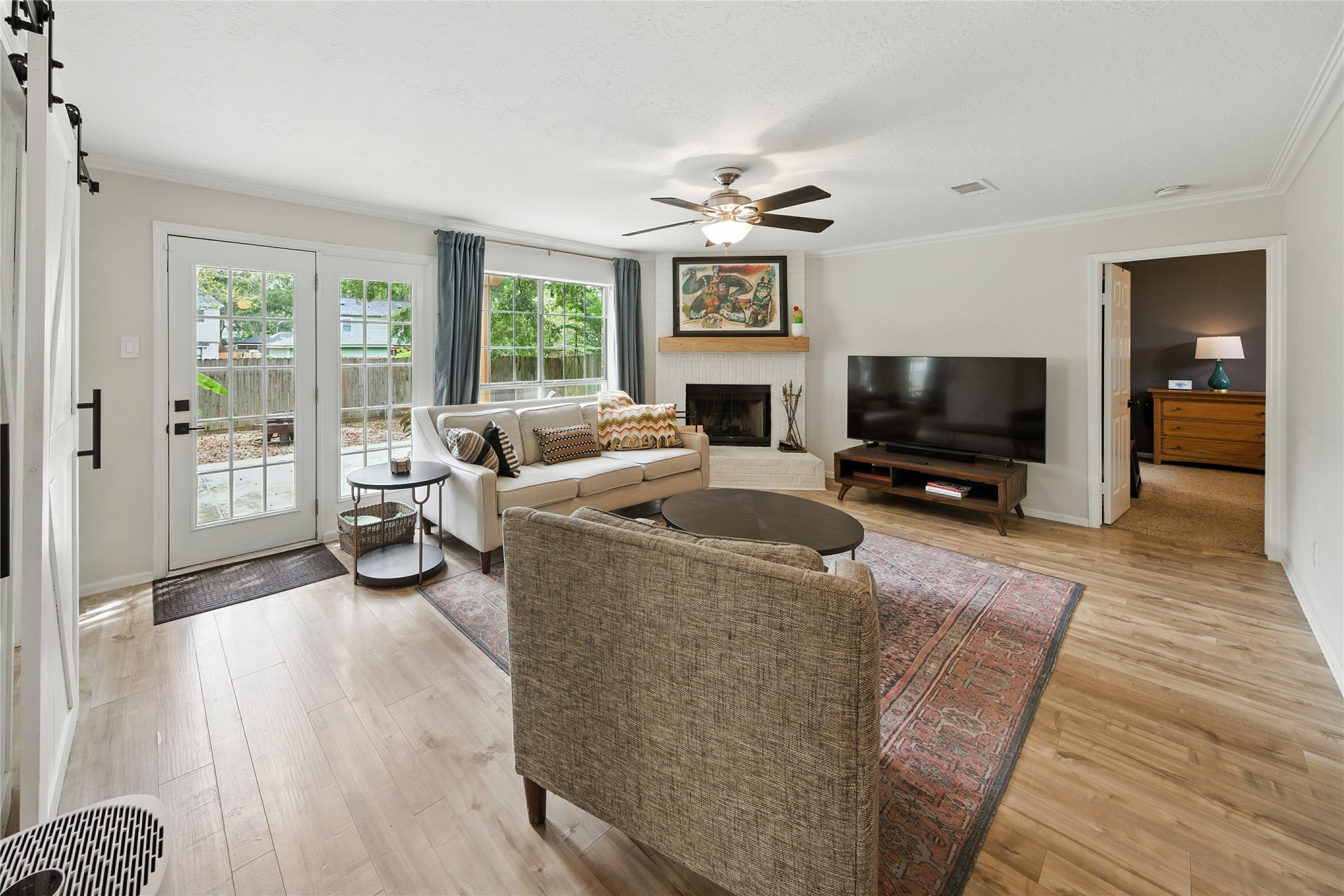 115 Regency Way Conroe, TX 77304 - Photo 6 of 32 a living room with furniture and a flat screen tv