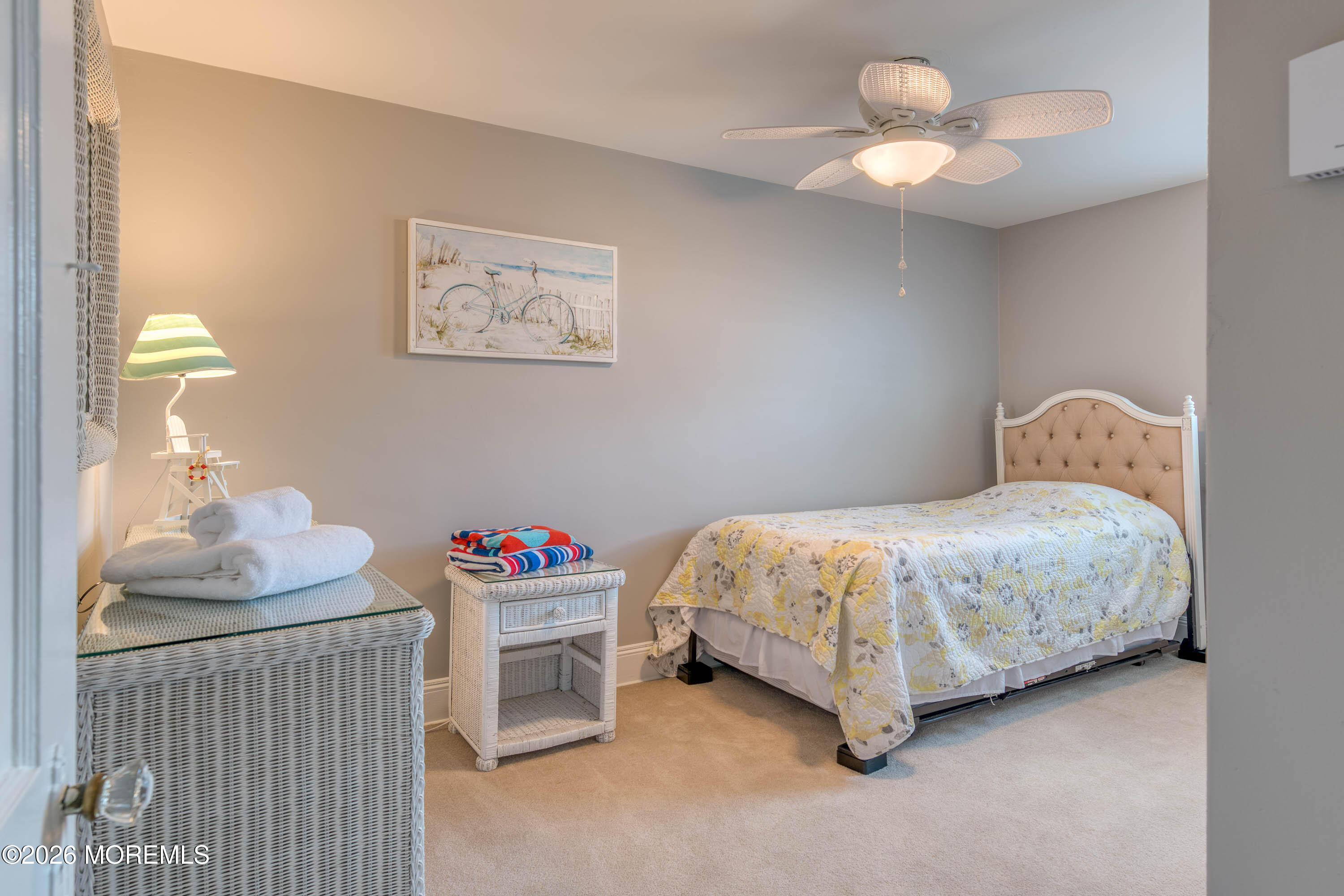 2 Via Ripa, Unit 2 Sea Bright, NJ 07760 - Photo 11 of 27 a bedroom with a bed and a chandelier