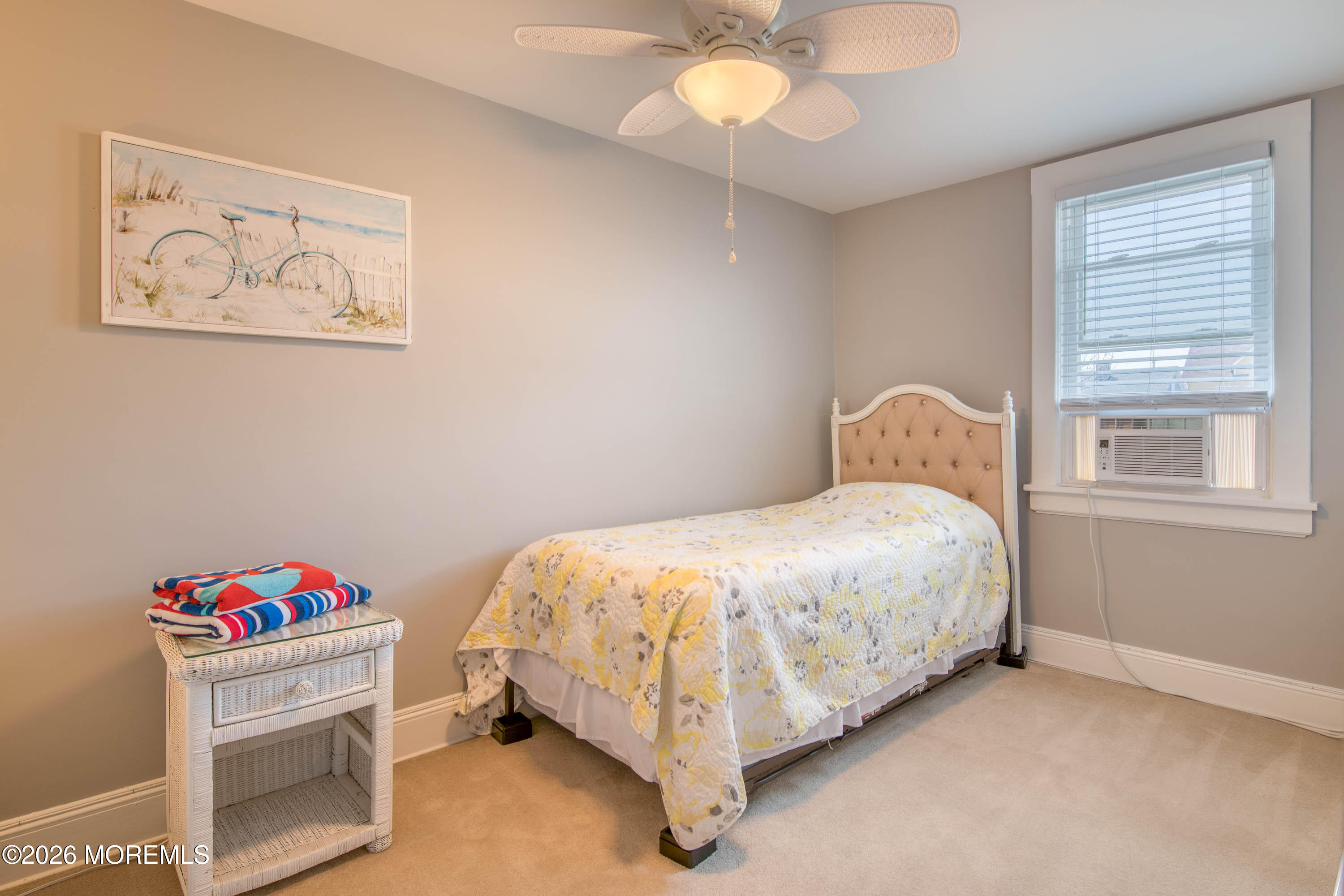 2 Via Ripa, Unit 2 Sea Bright, NJ 07760 - Photo 12 of 27 a bedroom with a bed and a chandelier