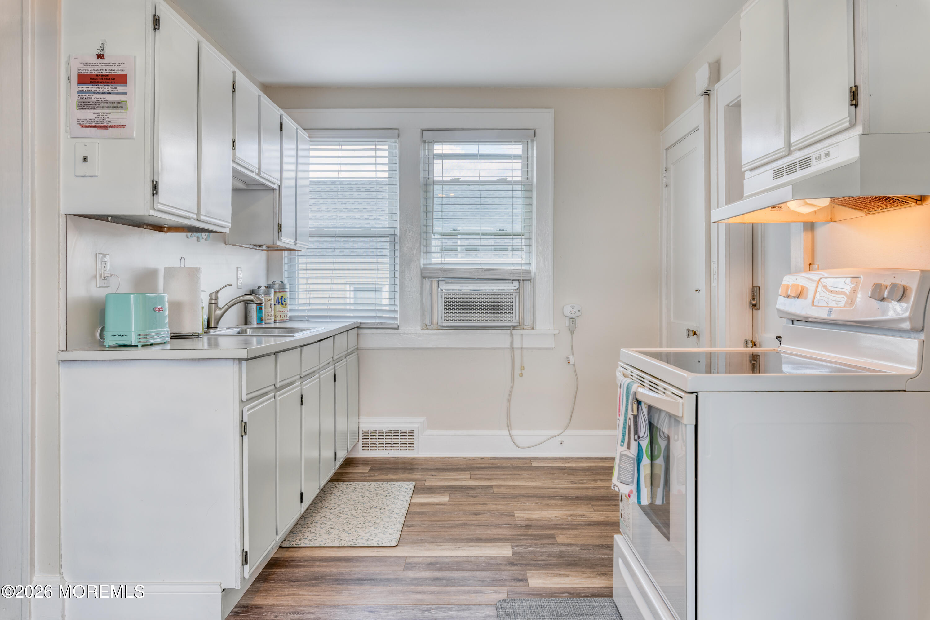 2 Via Ripa, Unit 2 Sea Bright, NJ 07760 - Photo 5 of 27 a kitchen with granite countertop cabinets stainless steel appliances a sink and a window