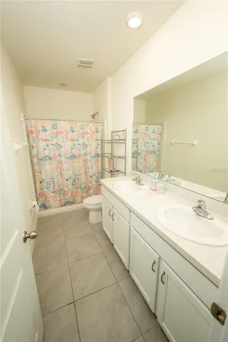 a view of walk in closet with clothes