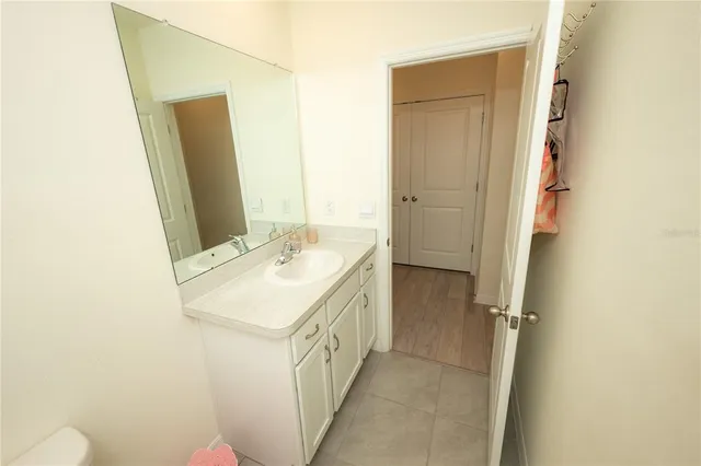 a view of hallway with wooden floor