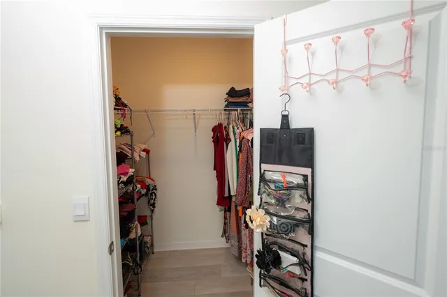 a bedroom with a bed and hallway