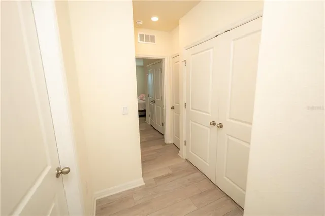 a view of a bathroom from a hallway