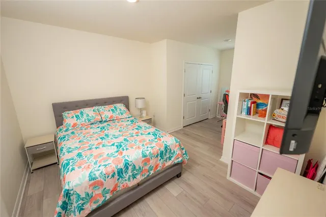 a view of house with swimming pool and outdoor seating