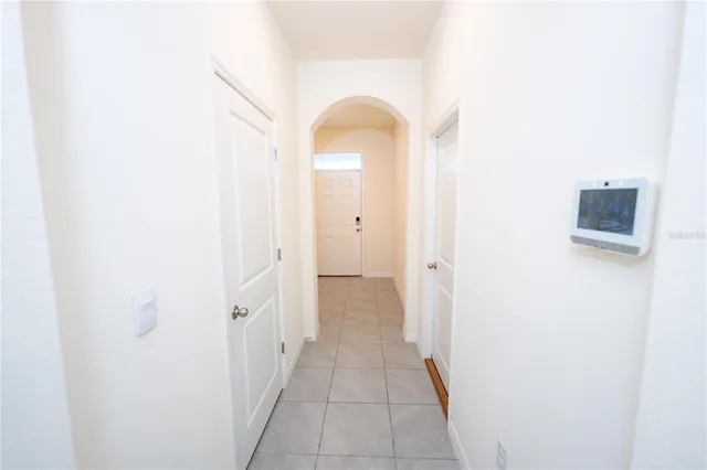a kitchen with refrigerator and window
