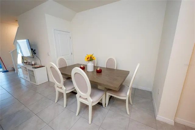 a kitchen with granite countertop white cabinets and a sink