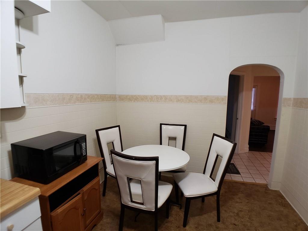518 Middle Avenue Wilmerding, PA 15148 - Photo 3 of 13 a view of a dining room with furniture and wooden floor