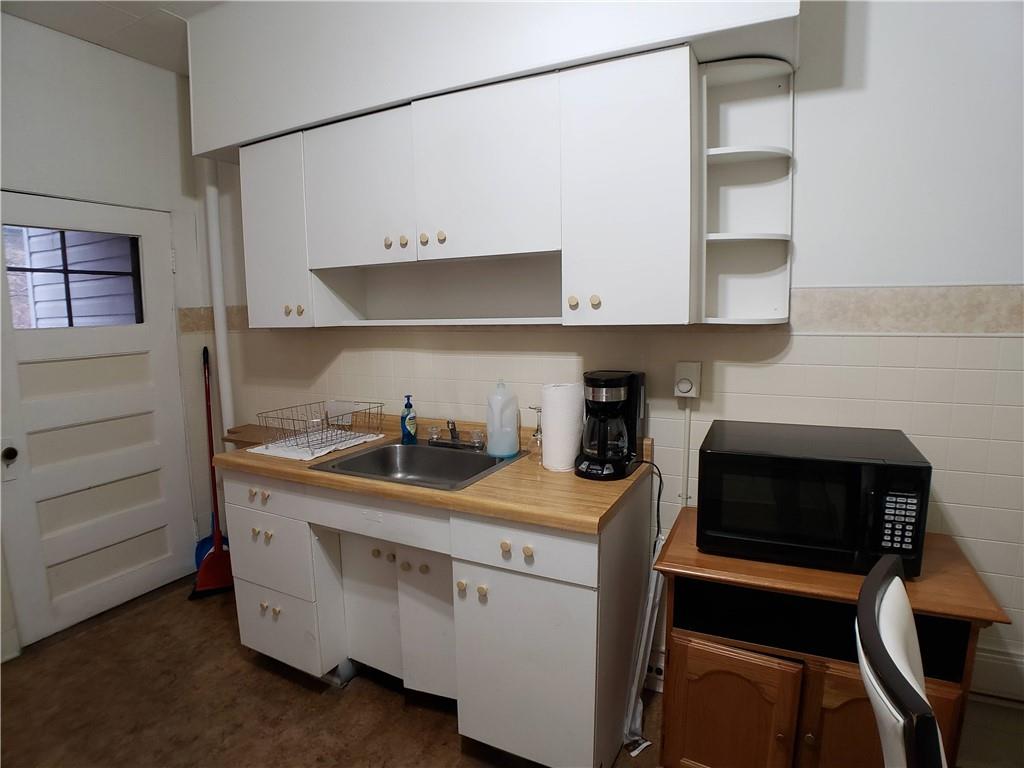 518 Middle Avenue Wilmerding, PA 15148 - Photo 4 of 13 a kitchen with a stove and a cabinets
