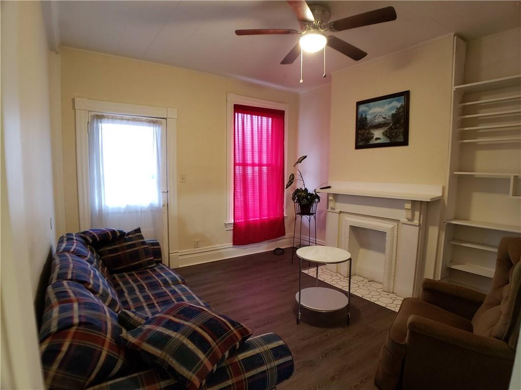 518 Middle Avenue Wilmerding, PA 15148 - Photo 5 of 13 a bedroom with furniture and a fireplace