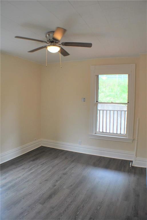 518 Middle Avenue Wilmerding, PA 15148 - Photo 8 of 13 wooden floor in an empty room with a window