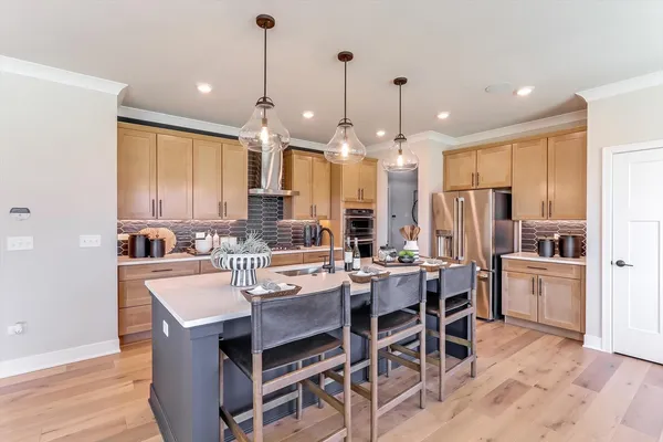 a view of a dining room kitchen and kitchen island