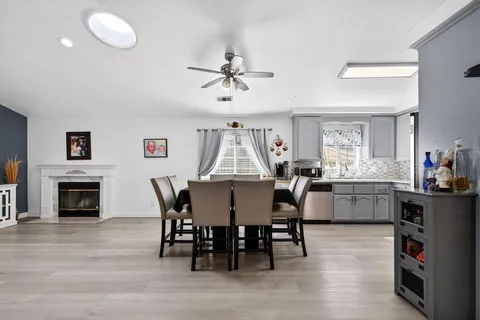 a dining room with furniture and window