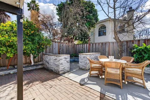 a view of a bench in the backyard