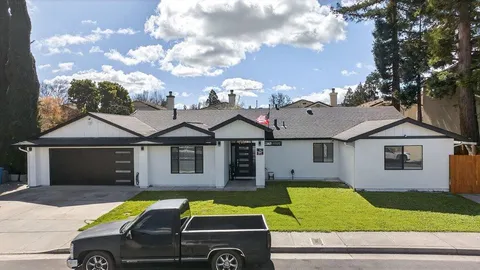 a front view of a house with garden