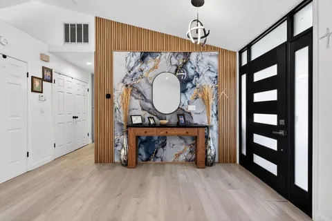 a view of front door with outdoor seating