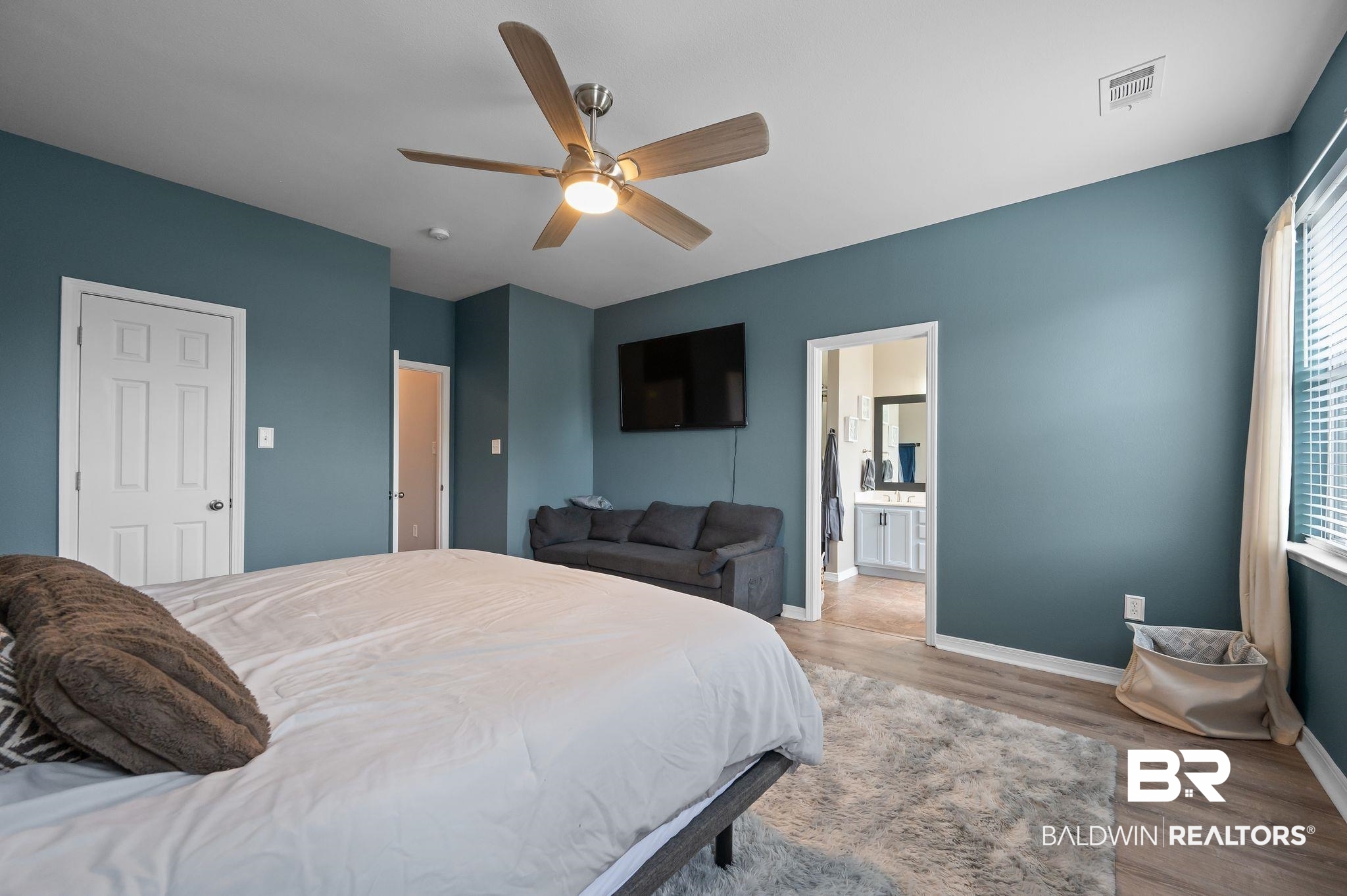 1287 Pembroke Way Foley, AL 36535 - Photo 22 of 39 Bedroom with light wood finished floors, a ceiling fan, and ensuite bath