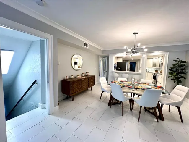 a living room with furniture and a book shelf