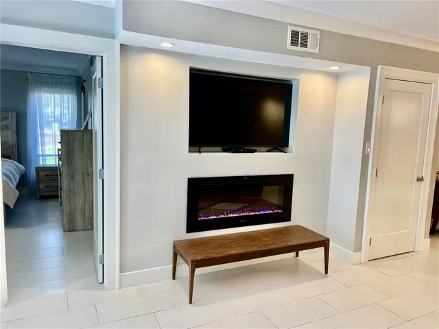 a bedroom with a bed couch and window