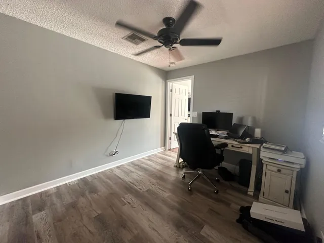 a bathroom with a toilet sink and a mirror
