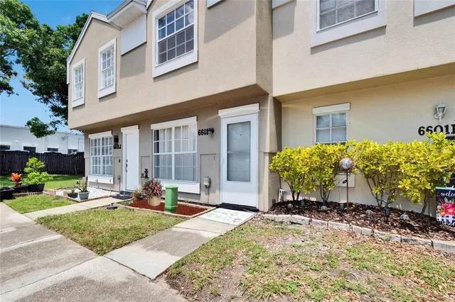 a front view of a building with sitting area