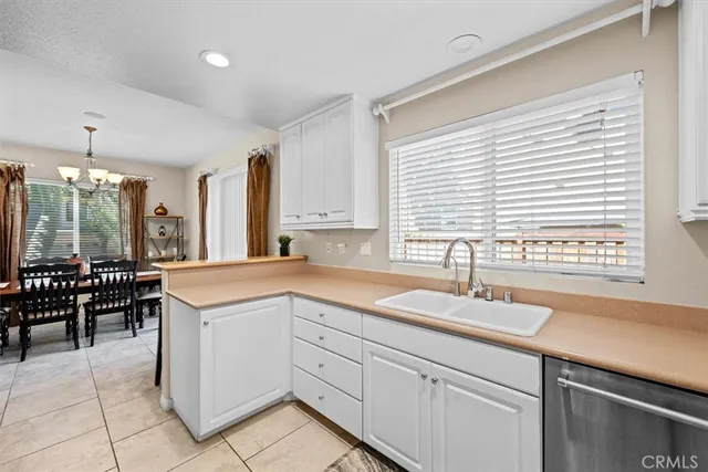 a kitchen with stainless steel appliances a stove microwave and refrigerator