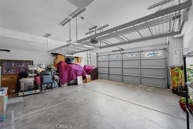 a view of a patio with table and chairs and potted plants