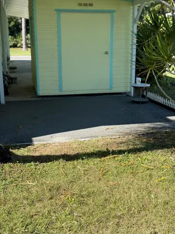 a view of swimming pool from a yard