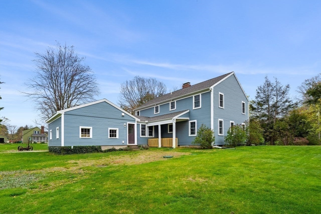 501 Great Road Stow, MA 01775 - Photo 29 of 32 a front view of a house with a garden