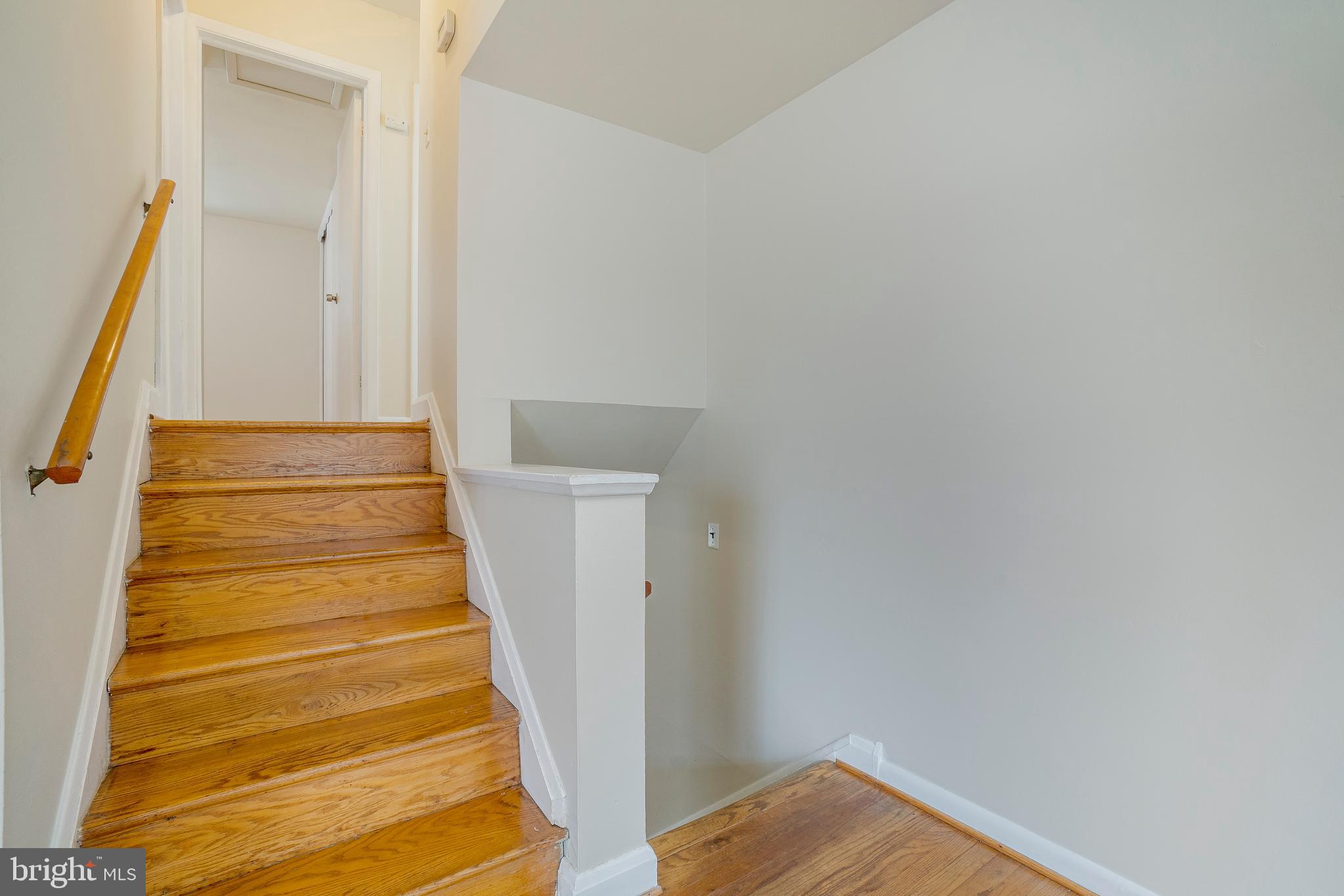 9110 Lamaze Road Baltimore, MD 21234 - Photo 15 of 26 Hardwood Stairs to Upper and Lower Levels