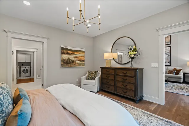 a bedroom with a bed and a dresser