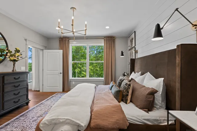 a bed room with a bed and a window