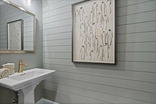 a bathroom with a sink and mirror