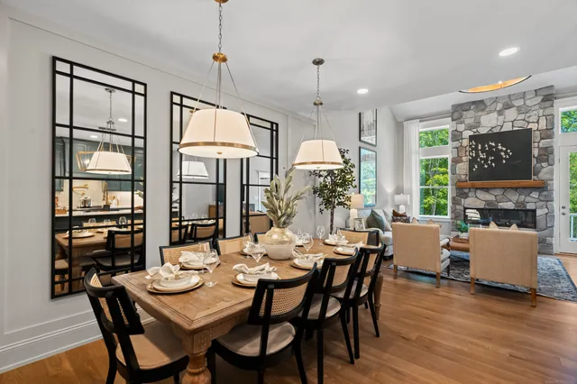 a view of a dining room with furniture window and wooden floor