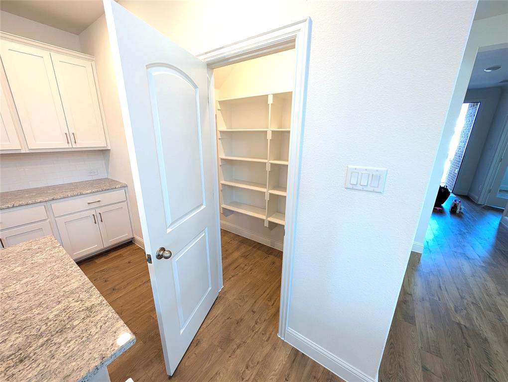 716 Blakelys Way Fate, TX 75189 - Photo 6 of 15 a view of bedroom with wooden floor and bedroom