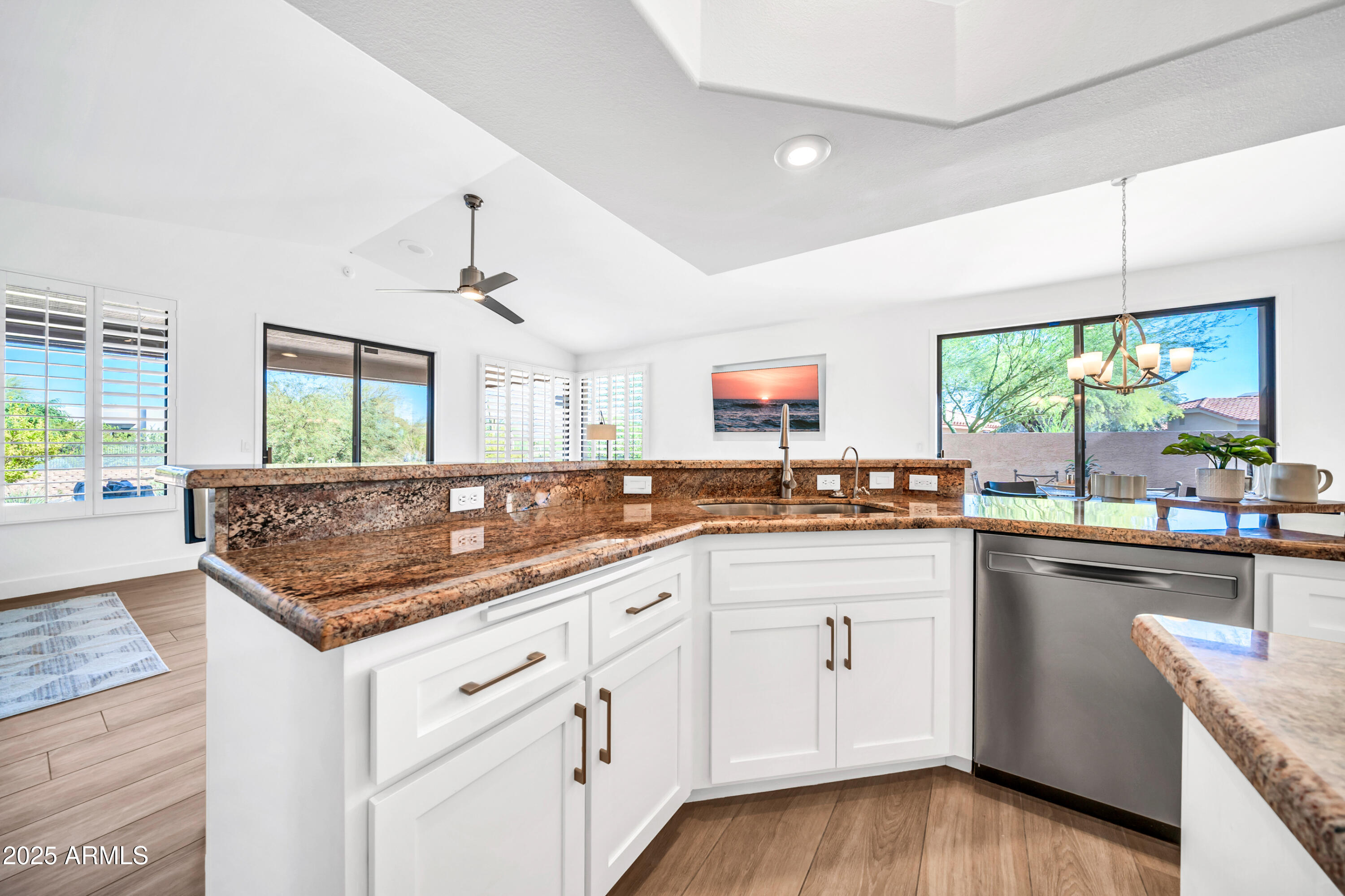 18820 East Gemmill Drive Rio Verde, AZ 85263 - Photo 13 of 72 a kitchen with white cabinets and wooden floor
