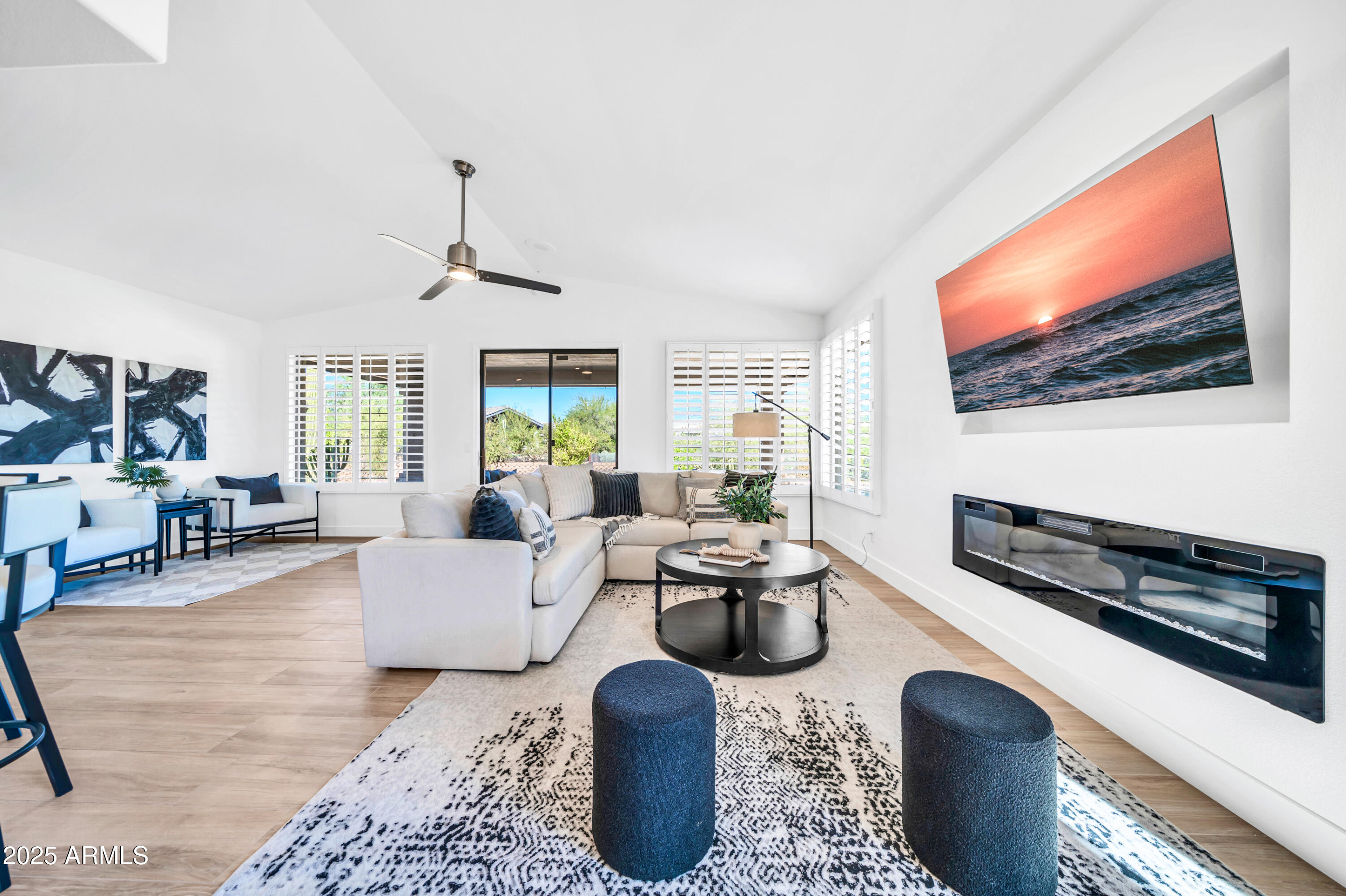 18820 East Gemmill Drive Rio Verde, AZ 85263 - Photo 17 of 72 a living room with furniture a rug and a flat screen tv