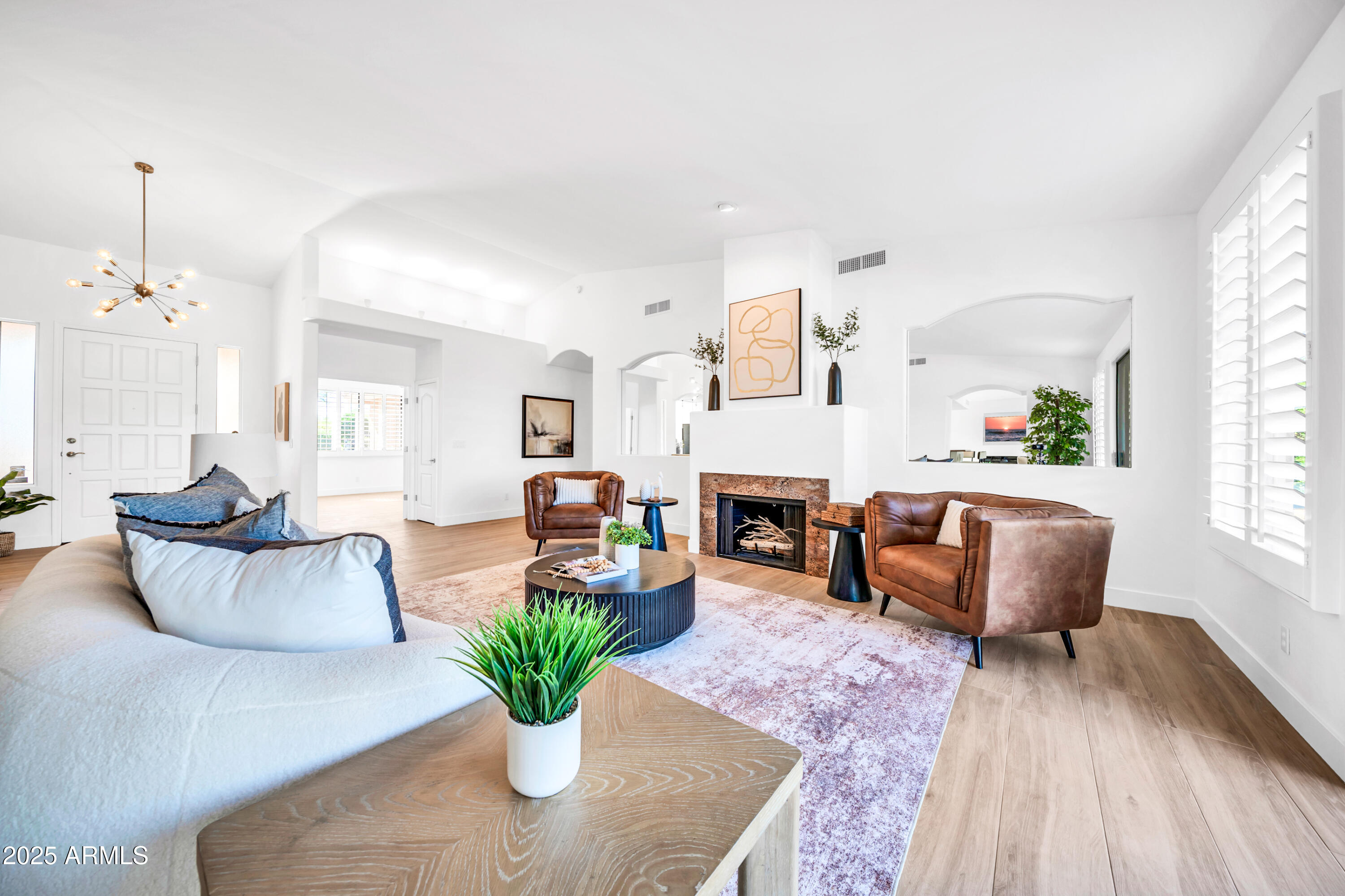 18820 East Gemmill Drive Rio Verde, AZ 85263 - Photo 27 of 72 a living room with furniture potted plant and a fireplace