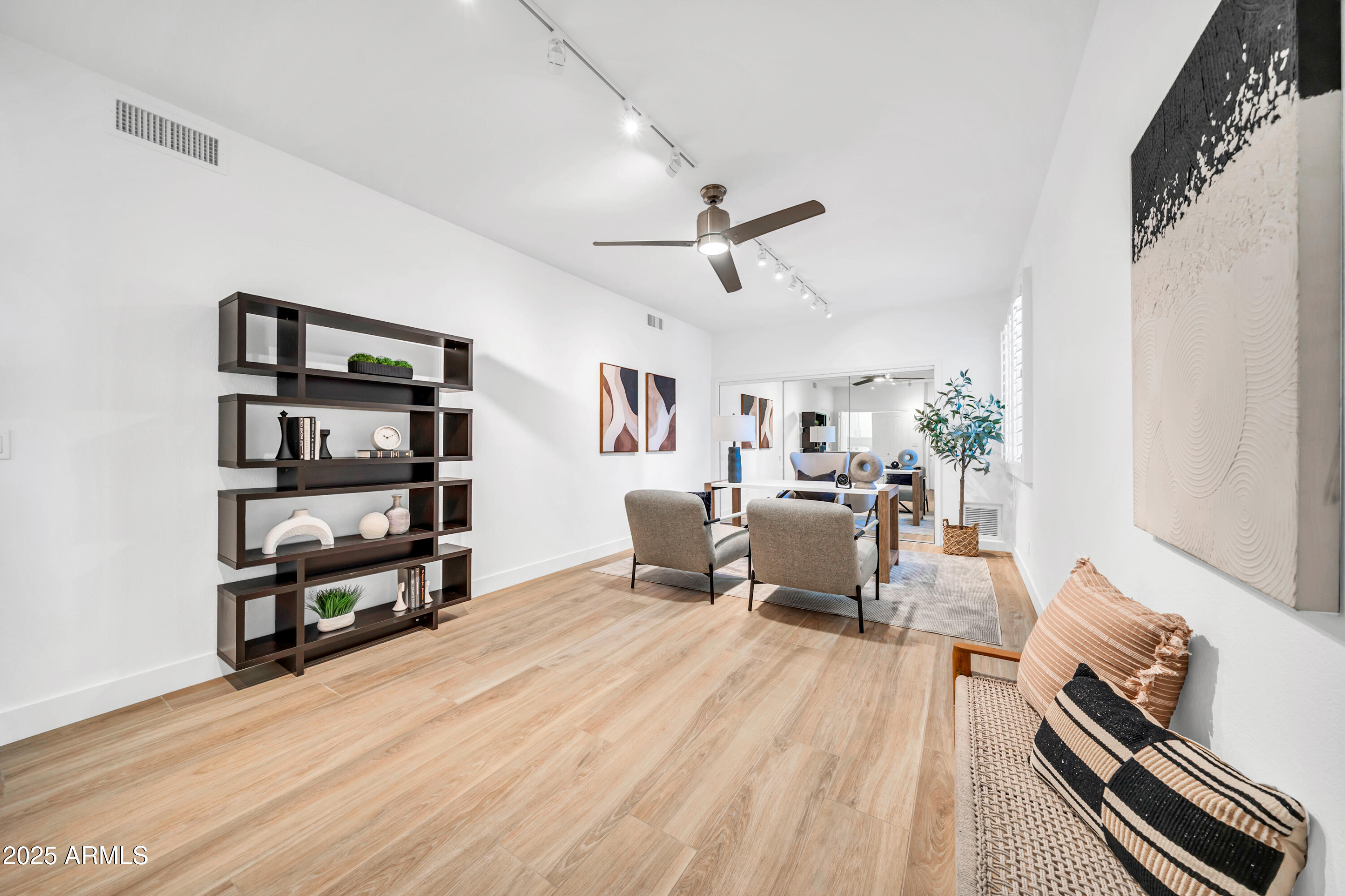 18820 East Gemmill Drive Rio Verde, AZ 85263 - Photo 31 of 72 a living room with furniture and a book shelf