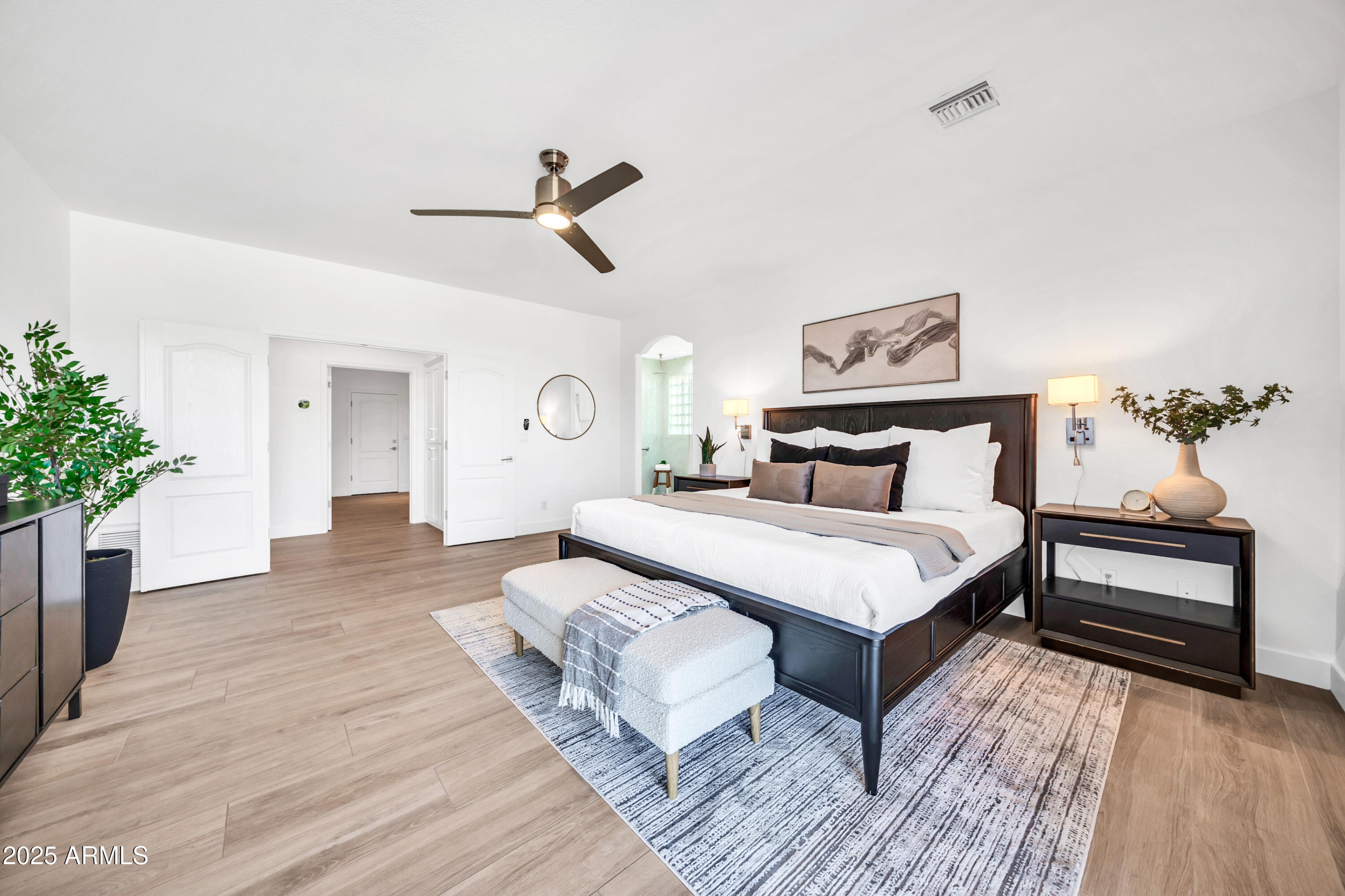 18820 East Gemmill Drive Rio Verde, AZ 85263 - Photo 34 of 72 a bedroom with a bed and a chandelier