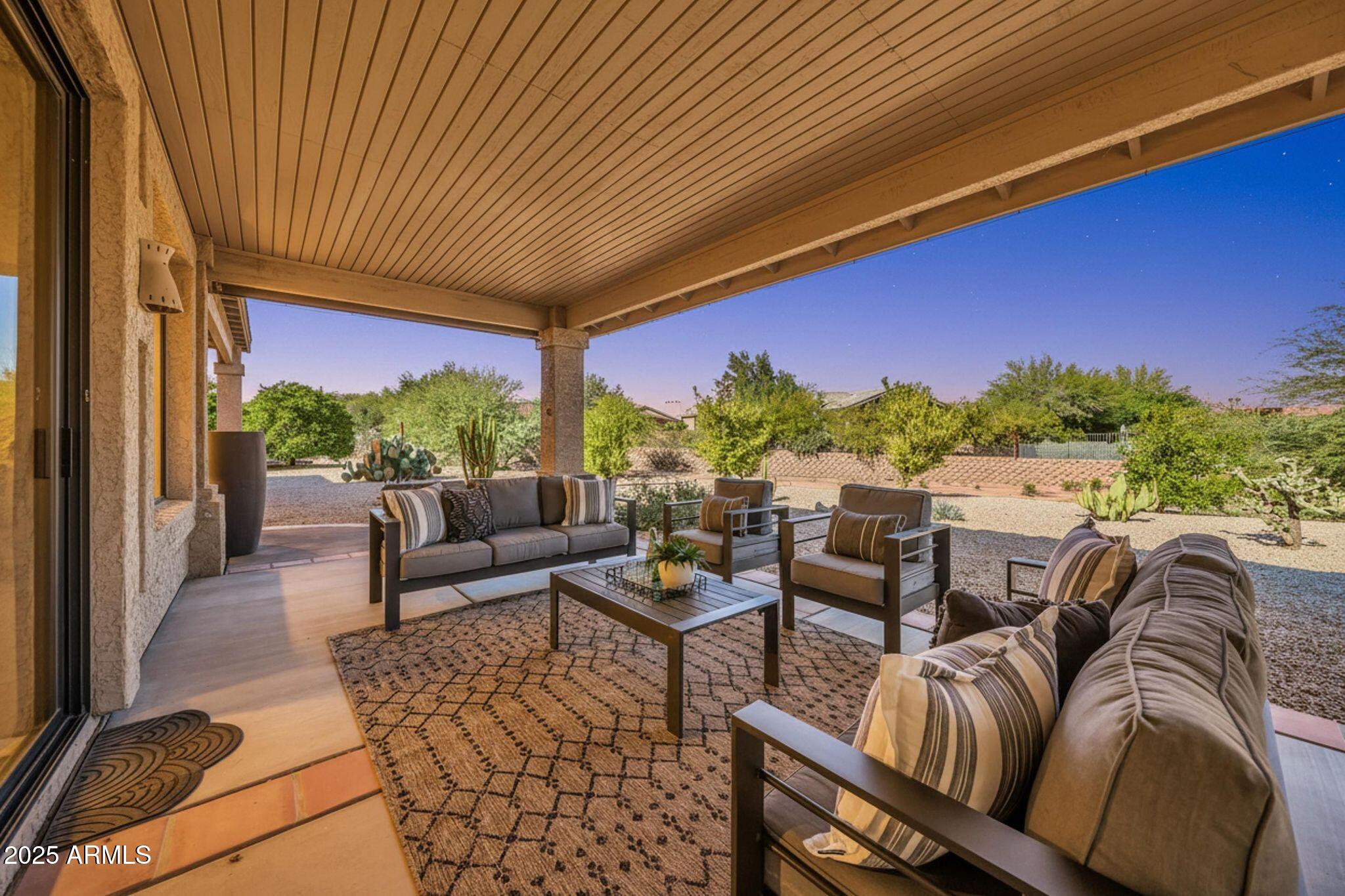 18820 East Gemmill Drive Rio Verde, AZ 85263 - Photo 3 of 72 a balcony with furniture and a potted plant