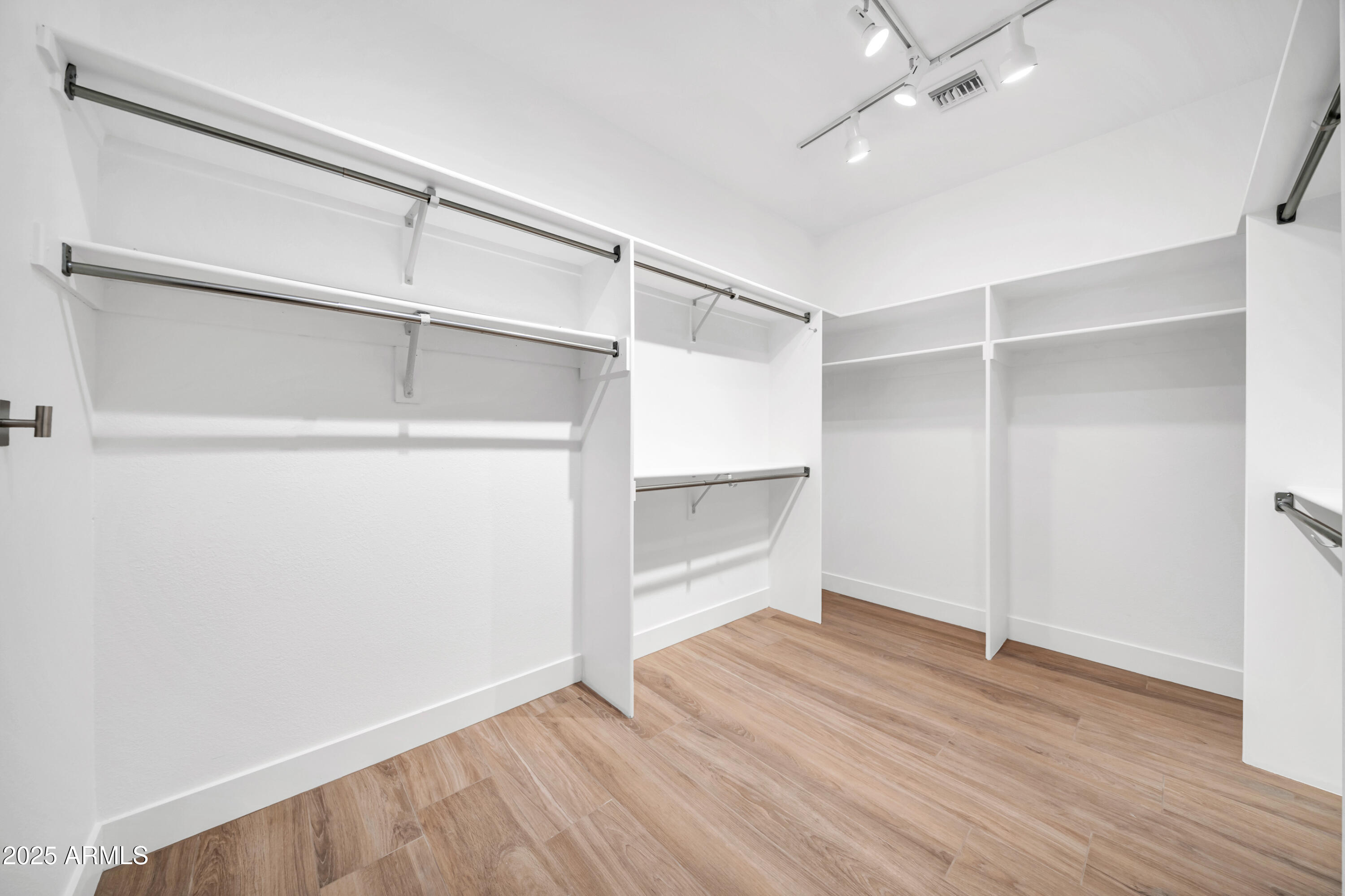 18820 East Gemmill Drive Rio Verde, AZ 85263 - Photo 43 of 72 an empty room with wooden floor closet and windows