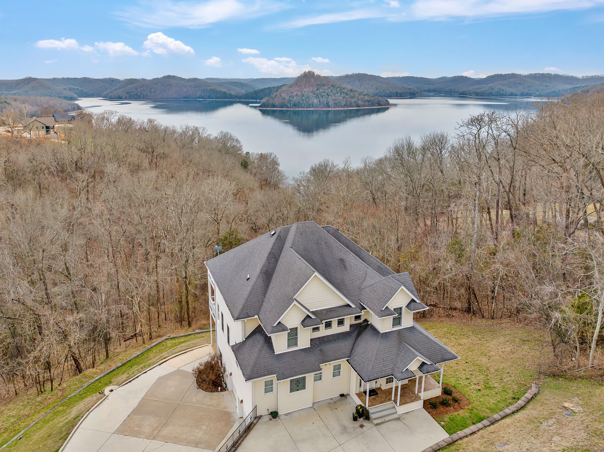a aerial view of a house with mountain view