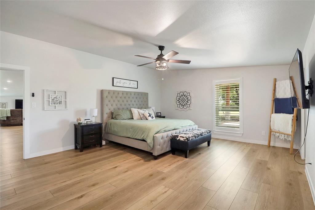 2408 Strader Road DISH, TX 76247 - Photo 15 of 40 a bedroom with a bed and a large window