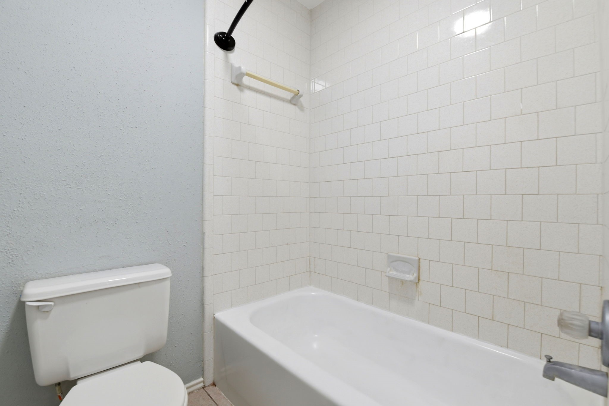 21330 Golden Dove Drive Spring, TX 77388 - Photo 16 of 29 A pristine tub and shower combination with a bright white tile surround.
