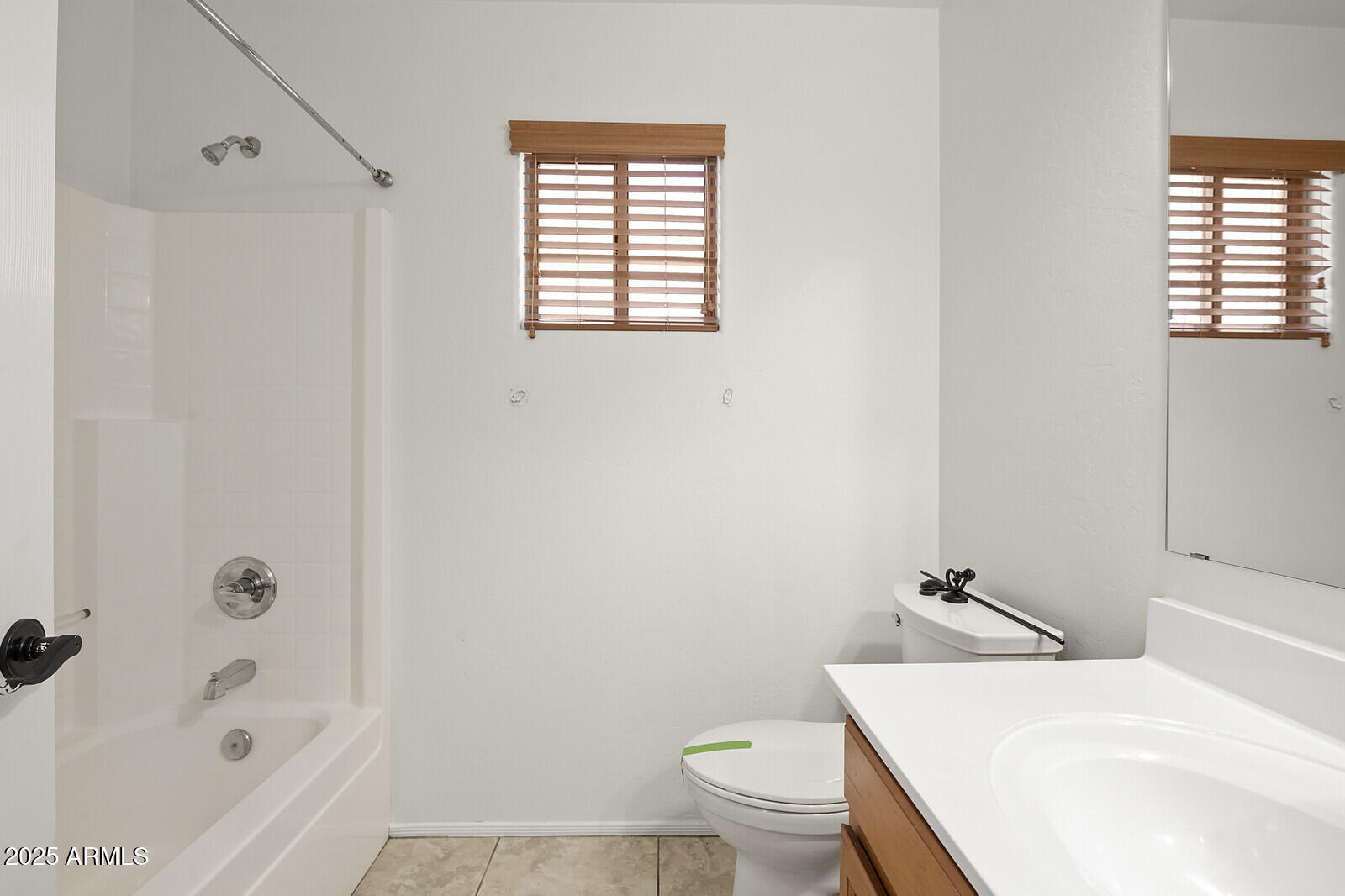 3297 East Warbler Road Gilbert, AZ 85297 - Photo 26 of 32 a bathroom with a sink toilet and shower