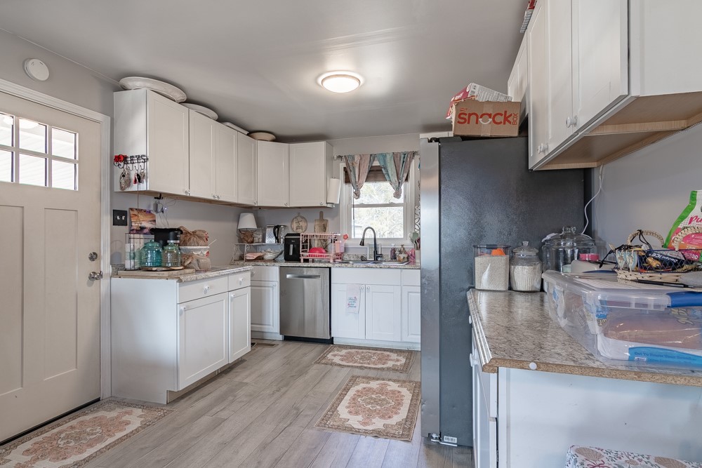 708 Sexton Gin Road Iva, SC 29655 - Photo 11 of 20 This bright kitchen features ample cabinetry and modern appliances, perfect for daily living.