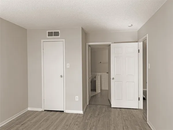 wooden floor with white walls
