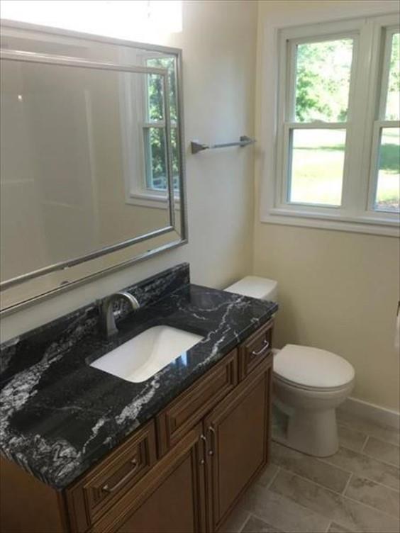 8131 Rowan Road Cranberry Township, PA 16066 - Photo 11 of 21 a bathroom with a granite countertop sink toilet and mirror