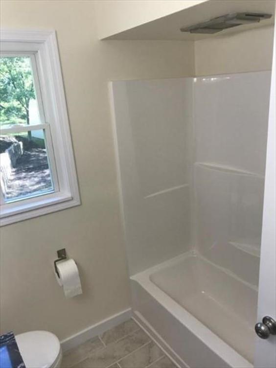 8131 Rowan Road Cranberry Township, PA 16066 - Photo 12 of 21 a bathroom with a shower and a bathtub